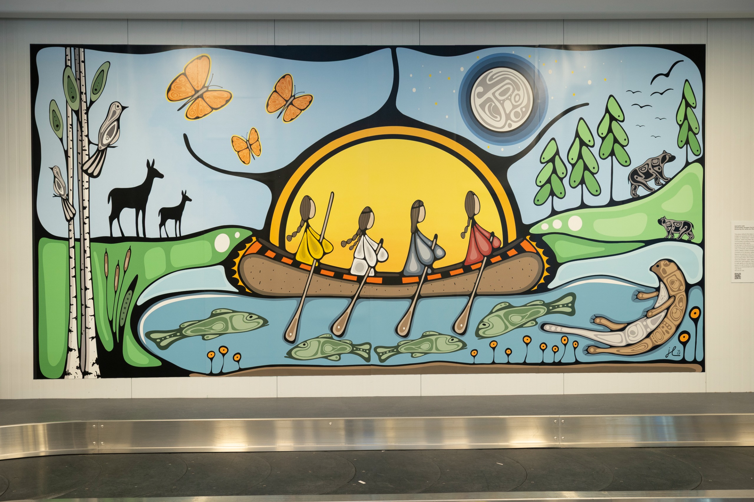 A mural from Honouring These Lands and Waterways Murals, and Ohontsà:ke nitioné:non onkwakara’shón:’a - Our Stories from the Land exhibit.