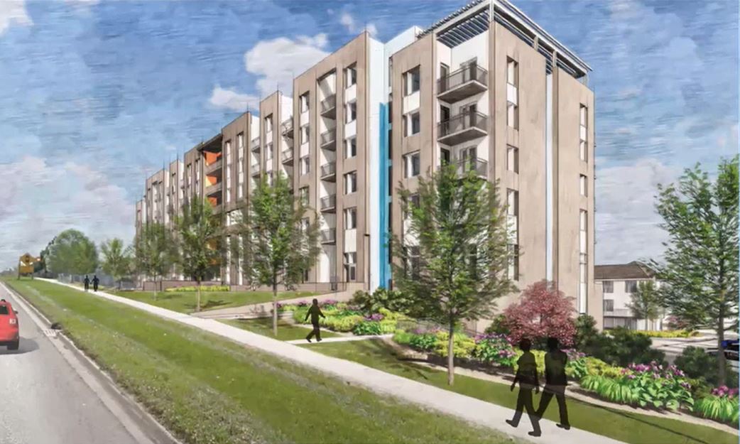 An illustration rendering of the future housing project in Beechwood. It's a view from Erb Street. A six storey-apartment style building. There are gardens and trees around the ground floor of the building. Figures of people are walking along a sidewalk b