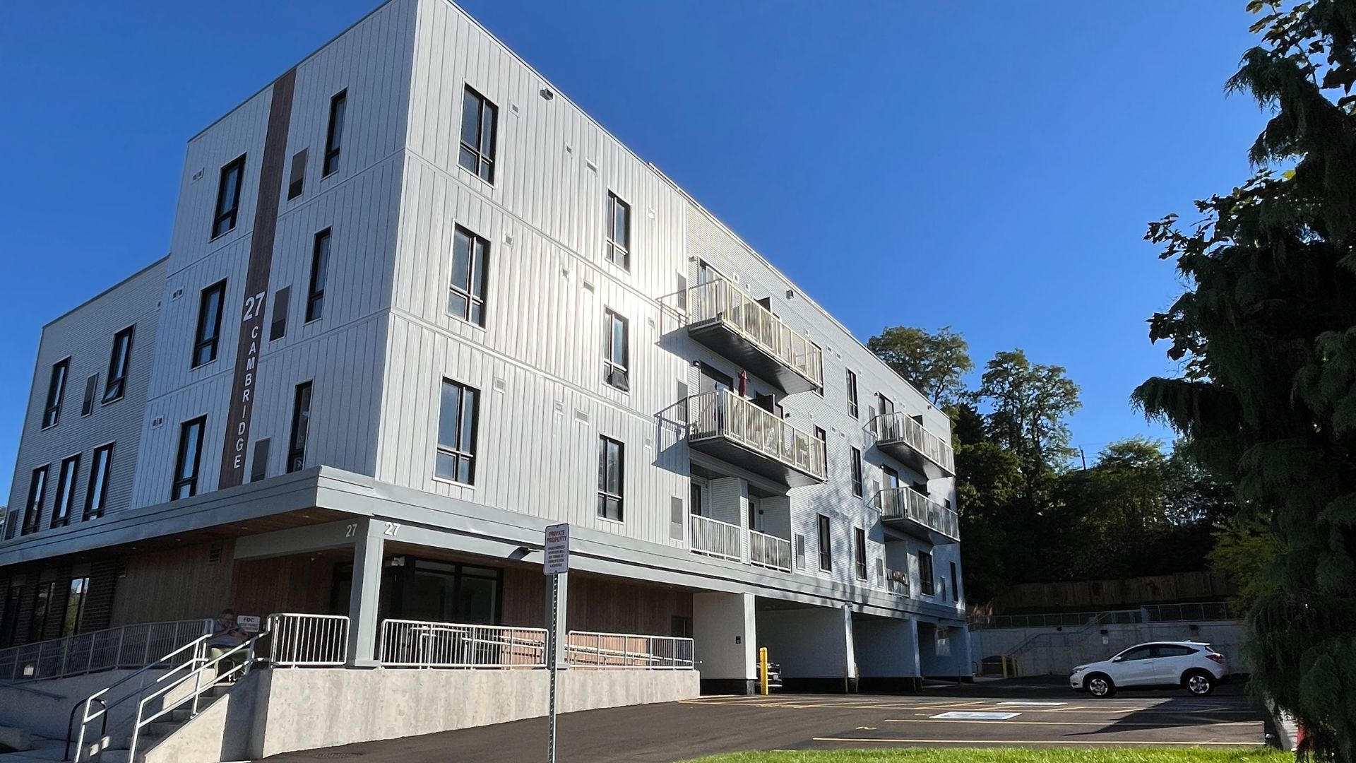 An affordable housing building with a blue sky in the background