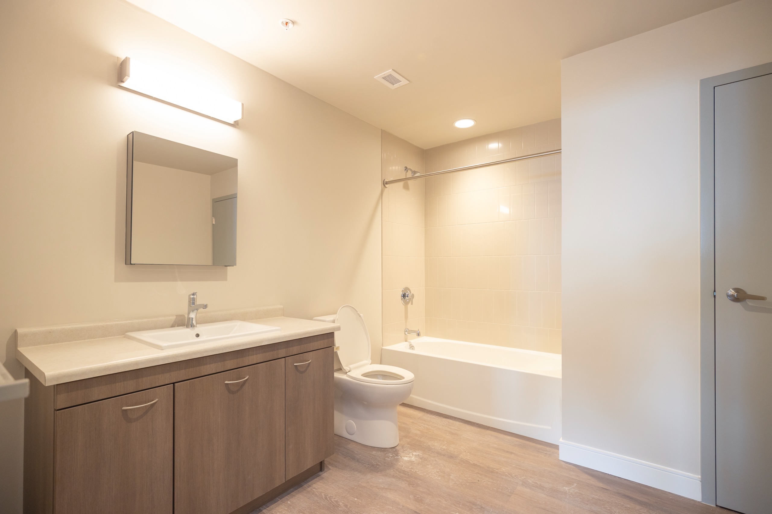 image of a full bathroom showing sink, toilet, bathtub and shower