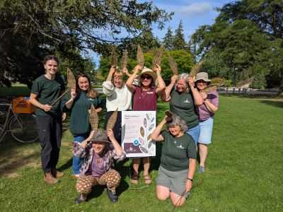 Community members showing their woven art