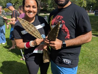 Community members showing their woven art