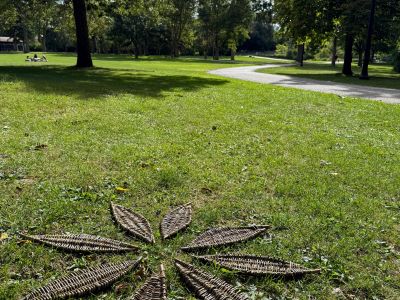 Participants' woven baskets together, forming a flower​
