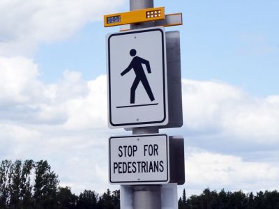 Crossover sign example with light on top.