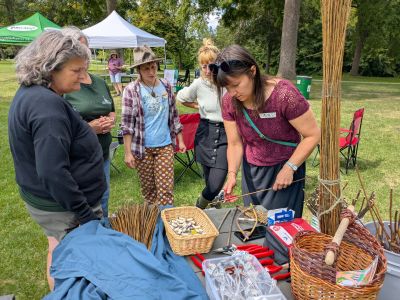 Community members using materials for weaving