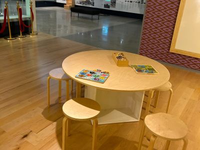 A small table and chairs in a bright space