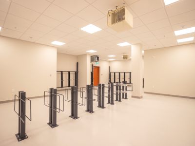image of the 420 kingscourt bike storage room which shows a large bright white room with dark grey bike parking posts coming from the ground